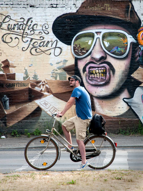 I was intrigued by the contrast between laid back cyclist, and the powerful graffiti.