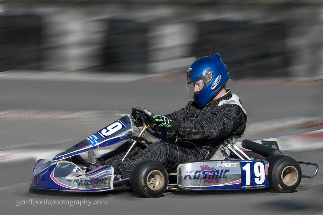 Taken in the local go-kart circuit, showing the expression of concentration.